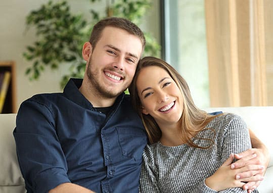 Man and Woman sitting on sofa