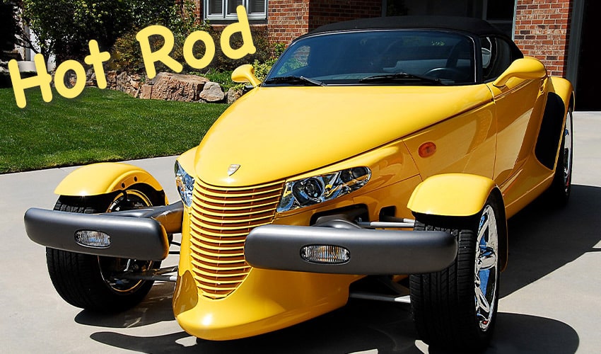 Prowler yellow Hot Rod in driveway sunny afternoon